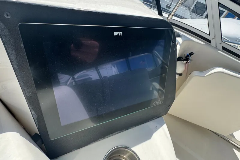Slide: The Image of Dashboard of a 2003 Silverton 43 Motor Yacht with a touchscreen display. - 19