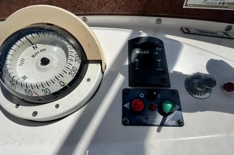 Slide: The Image of Compass and control panel on a 2003 Silverton 43 Motor Yacht. - 20