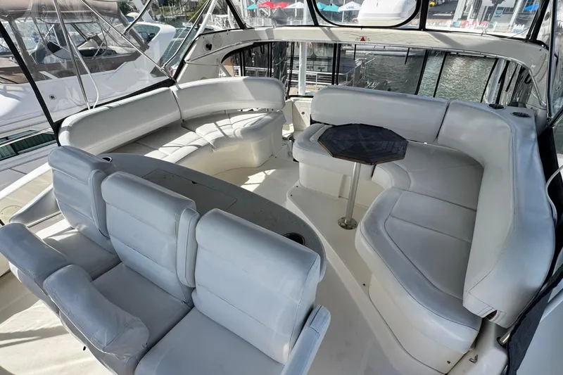 Slide: The Image of Luxurious 2003 Silverton 43 Motor Yacht interior with white seating and table. - 22