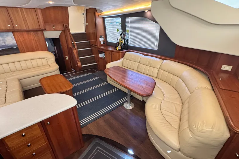 Slide: The Image of Luxurious interior of 2003 Silverton 43 Motor Yacht with leather seating and wooden finishes. - 29