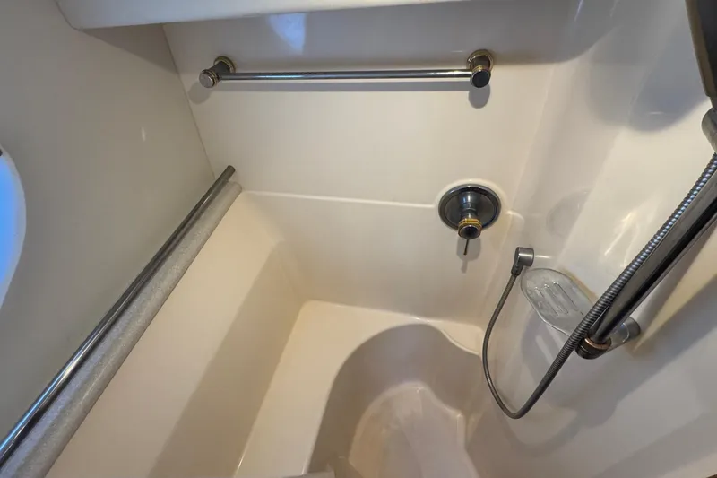 Slide: The Image of Shower area in a 2003 Silverton 43 Motor Yacht, featuring chrome fixtures. - 40