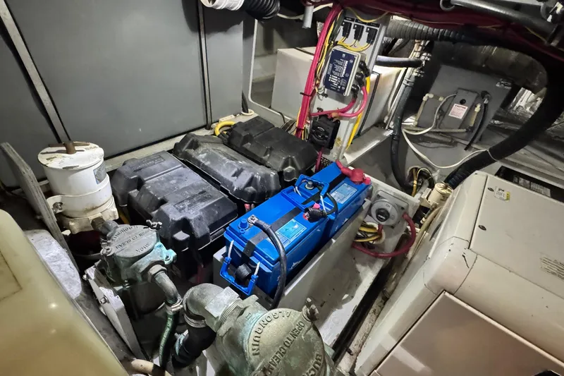 Slide: The Image of Engine room of 2003 Silverton 43 Motor Yacht with batteries and wiring. - 49