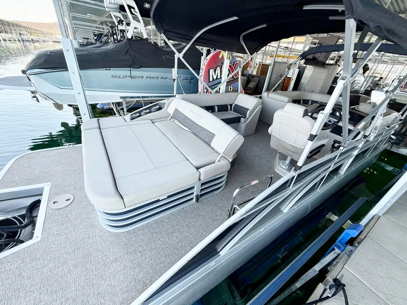 The Image of 2019 Bennington SX 25 Premium Swingback pontoon boat with spacious seating and modern design. - 1