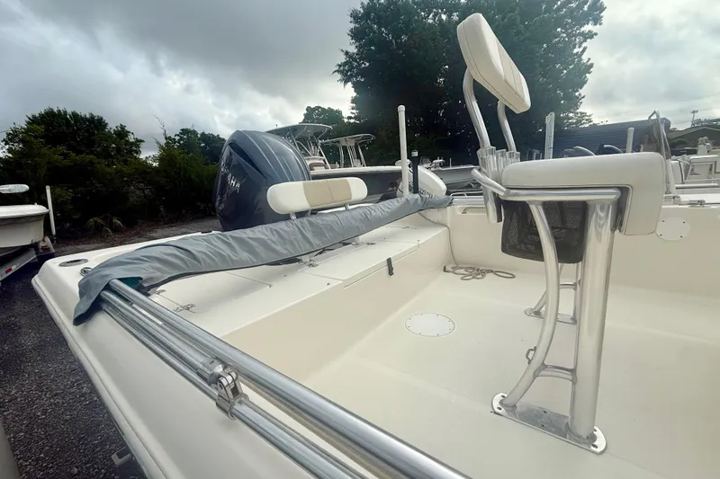 Slide: The Image of 2021 Bulls Bay 2200 boat with Yamaha engine, featuring sleek seating and railing. - 2