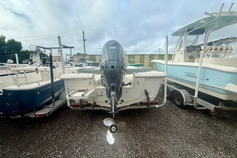 Slide: The Image of 2021 Bulls Bay 2200 boat with outboard motor, parked on gravel lot. - 9
