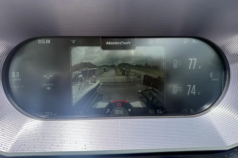 Slide: The Image of Dashboard display of a 2021 MasterCraft XT22 boat showing camera view and temperature readings. - 14