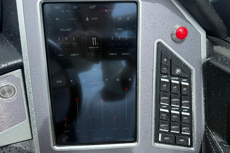 Slide: The Image of Control panel of a 2021 MasterCraft XT22 boat with touchscreen and buttons. - 15