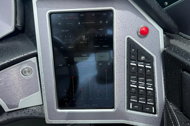 Slide: The Image of Control panel of a 2021 MasterCraft XT22 boat with touchscreen and buttons. - 16