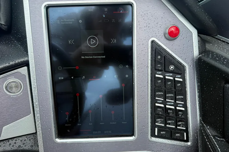 Slide: The Image of 2021 MasterCraft XT22 dashboard with touchscreen controls and buttons, showing no Bluetooth connection. - 18