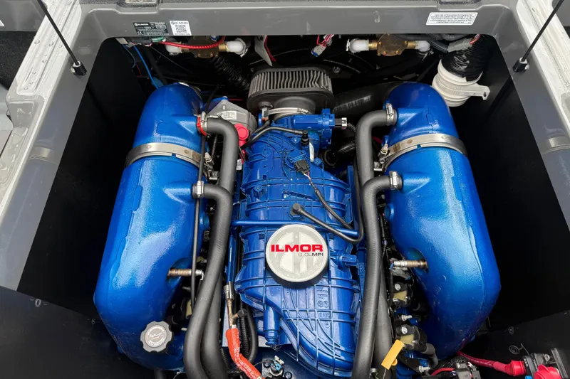 Slide: The Image of Engine of a 2021 MasterCraft XT22 boat with blue Ilmor components. - 27