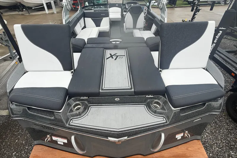 Slide: The Image of 2021 MasterCraft XT22 boat interior with sleek seating and modern design. - 35