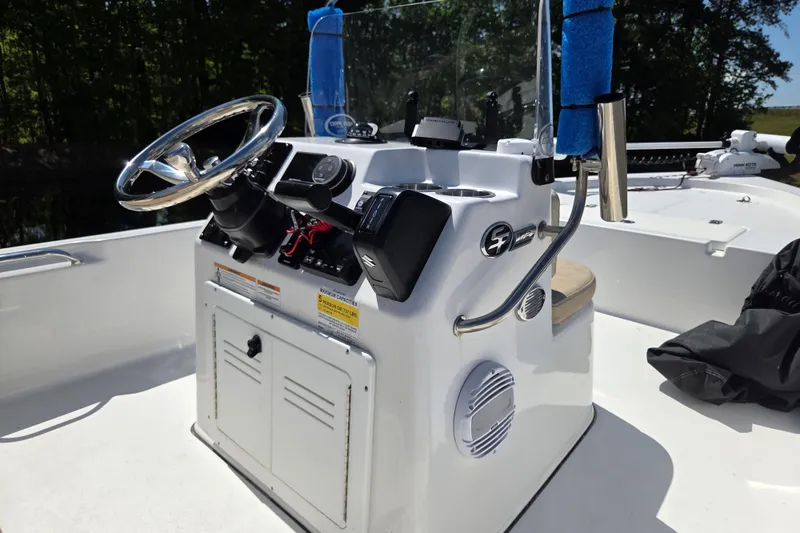 Slide: The Image of 2024 Sea Pro 172 Bay boat console with steering wheel and controls. - 11