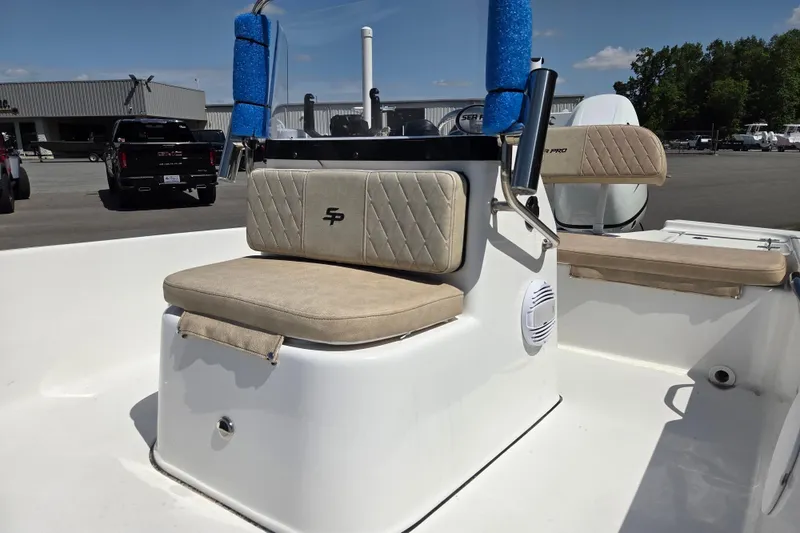Slide: The Image of 2024 Sea Pro 172 Bay boat interior with cushioned seating and console. - 9
