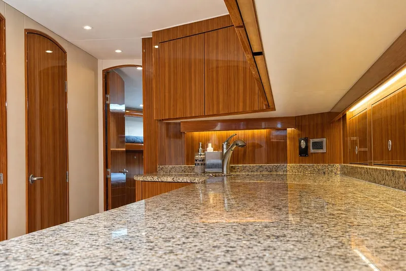 Slide: The Image of Luxurious interior of 2008 Viking 52 Sport Coupe yacht with granite countertops and wooden cabinetry. - 10