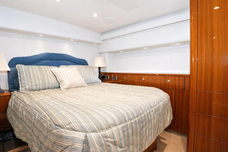 Slide: The Image of Luxurious bedroom interior of 2008 Viking 52 Sport Coupe yacht with elegant wood finishes. - 12