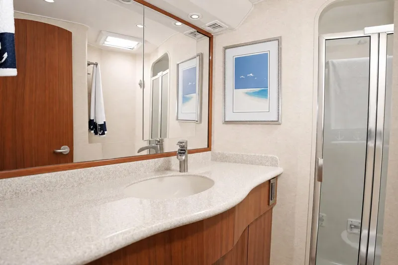 Slide: The Image of Luxurious bathroom in 2008 Viking 52 Sport Coupe yacht with modern fixtures and elegant design. - 14
