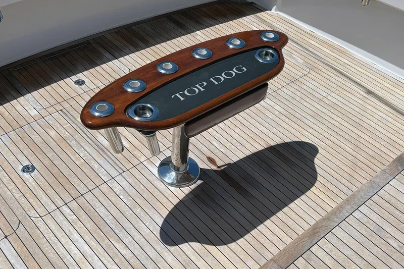 Slide: The Image of Teak deck of 2008 Viking 52 Sport Coupe with "Top Dog" fishing rod holder. - 18