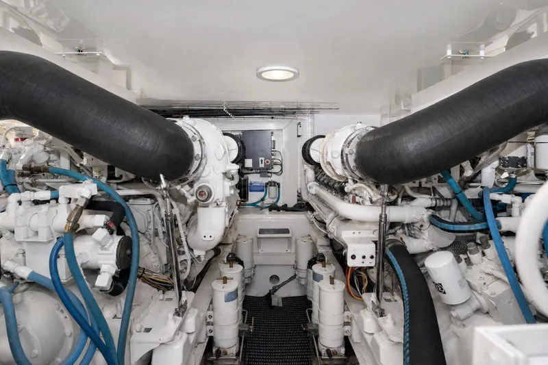 Slide: The Image of Engine room of a 2008 Viking 52 Sport Coupe with visible machinery and piping. - 21