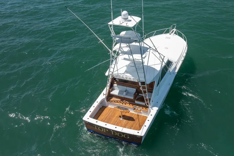 Slide: The Image of 2008 Viking 52 Sport Coupe yacht cruising on open water, aerial view. - 3