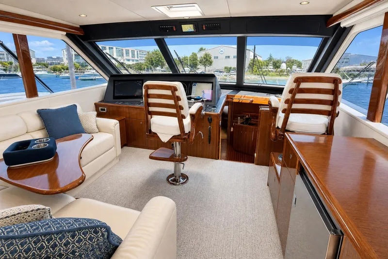 Slide: The Image of Luxurious interior of a 2008 Viking 52 Sport Coupe yacht with elegant seating and helm. - 7