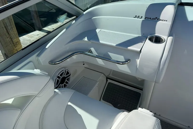 Slide: The Image of Interior of a 2003 Formula 353 FASTech boat, featuring white seating and stainless steel accents. - 11