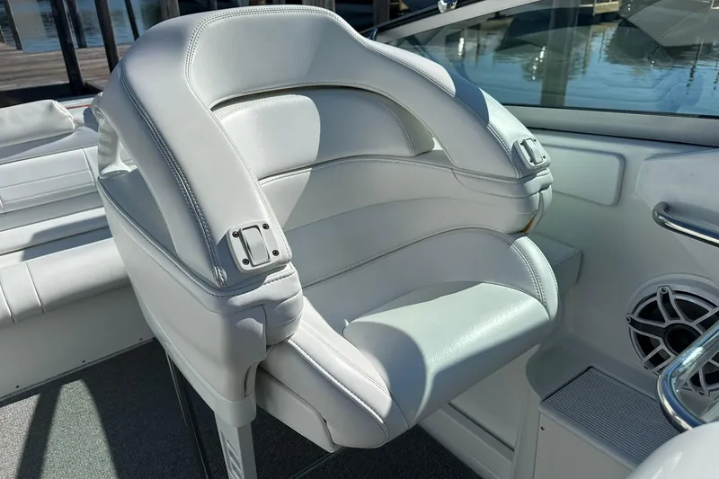 Slide: The Image of White leather seat on a 2003 Formula 353 FASTech boat, featuring sleek design and speaker detail. - 14