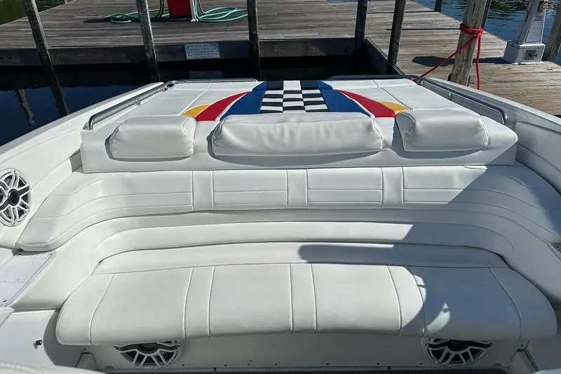 Slide: The Image of 2003 Formula 353 FASTech boat interior with white leather seating and colorful design accents. - 15