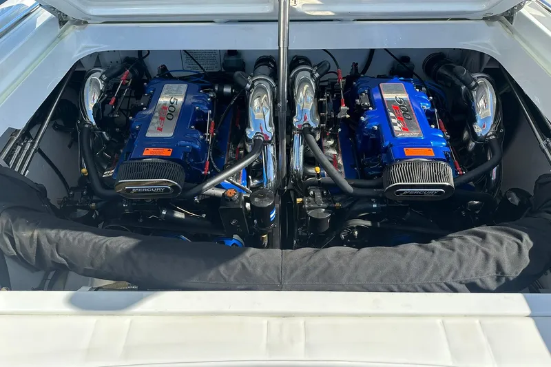 Slide: The Image of Twin Mercury engines in a 2003 Formula 353 FASTech boat engine compartment. - 16
