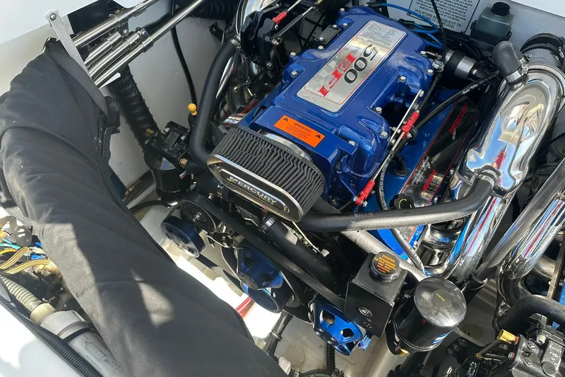 Slide: The Image of Engine of a 2003 Formula 353 FASTech boat, featuring a Mercury 500 EFI motor. - 17
