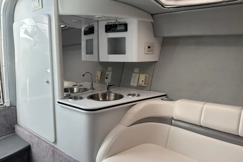 Slide: The Image of Interior of a 2003 Formula 353 FASTech boat with kitchenette and seating area. - 24