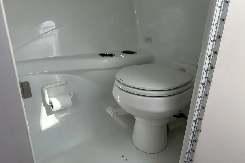 Slide: The Image of Compact bathroom in 2003 Formula 353 FASTech boat with toilet and paper holder. - 25