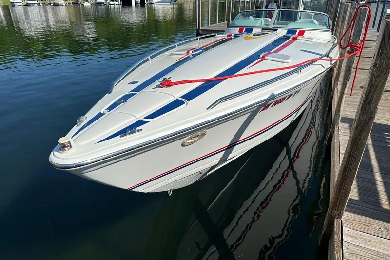 Slide: The Image of 2003 Formula 353 FASTech boat docked at marina, featuring sleek design and vibrant accents. - 3