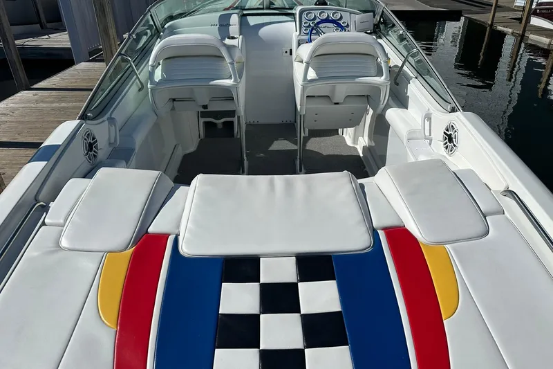 Slide: The Image of 2003 Formula 353 FASTech boat interior with colorful seating and sleek design. - 7