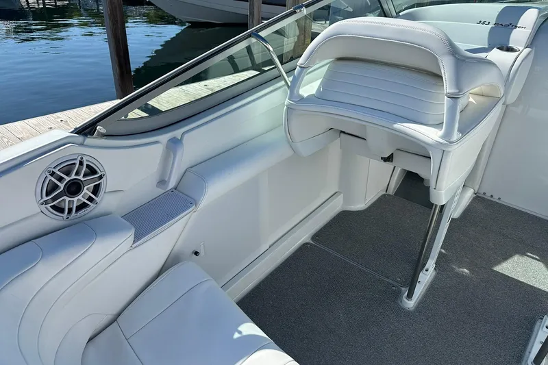Slide: The Image of Interior of a 2003 Formula 353 FASTech boat with white seating and speaker. - 8