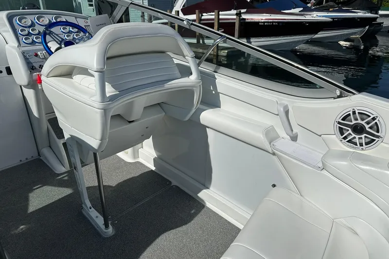 Slide: The Image of Interior of a 2003 Formula 353 FASTech boat with white seating and control panel. - 9