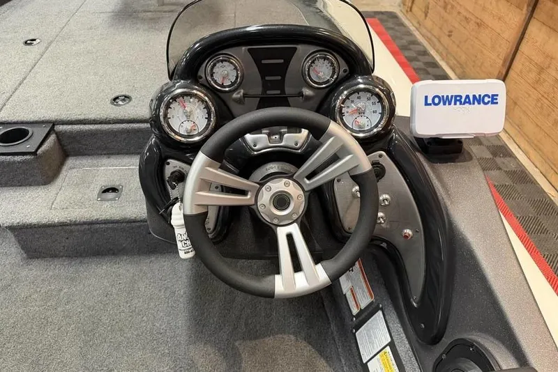 Slide: The Image of 2024 Tracker Pro Team 190 TX boat dashboard with steering wheel and Lowrance display. - 7