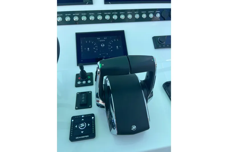 Slide: The Image of Control panel of 2026 Reef Runner 340 boat with advanced navigation system. - 13