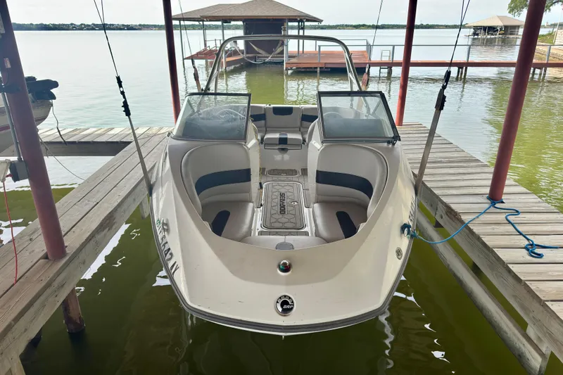 The Image of 2008 Sea-Doo Sport Boats 180 Challenger docked on a serene lake. - 0