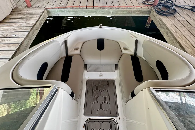 Slide: The Image of Interior view of a 2008 Sea-Doo Sport Boats 180 Challenger, featuring cushioned seating. - 7