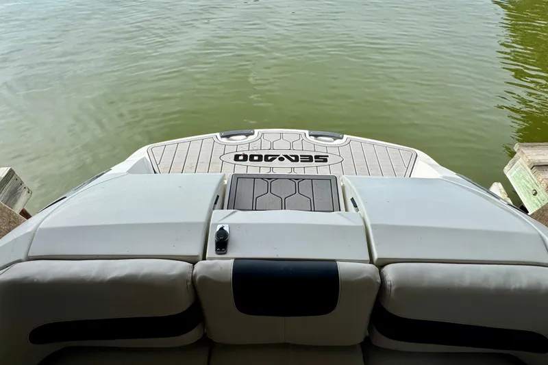 Slide: The Image of 2008 Sea-Doo 180 Challenger boat stern view on calm water. - 8