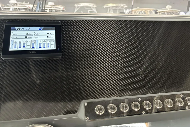 Slide: The Image of Dashboard of 2026 Highfield Patrol 760 with Yamaha display and carbon fiber finish. - 15