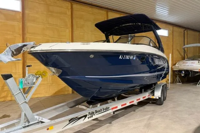 Slide: The Image of 2016 Sea Ray SLX 280 boat on trailer in indoor storage facility. - 1