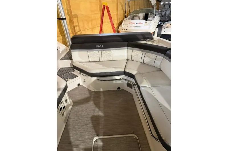 Slide: The Image of Interior seating of a 2016 Sea Ray SLX 280 boat, featuring elegant upholstery. - 10