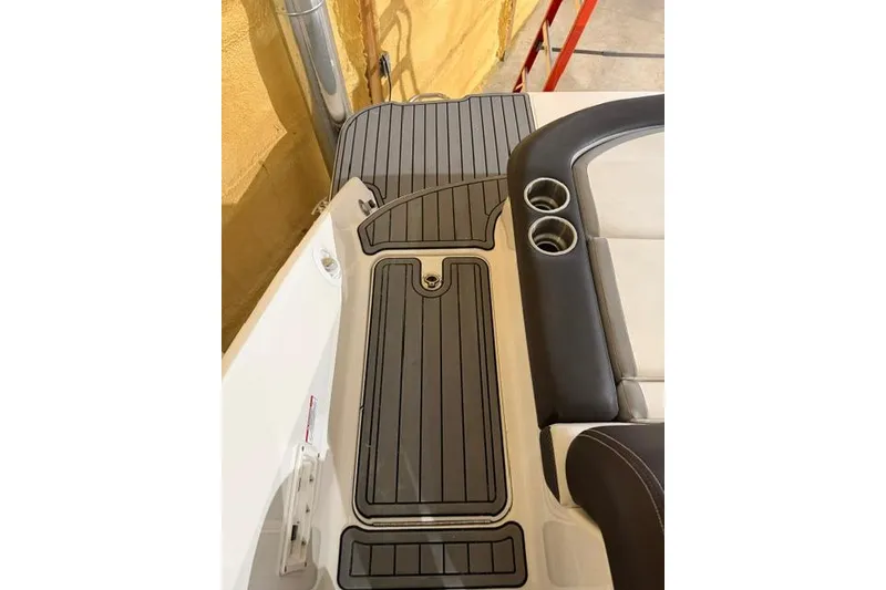 Slide: The Image of 2016 Sea Ray SLX 280 boat interior with cup holders and sleek flooring design. - 17