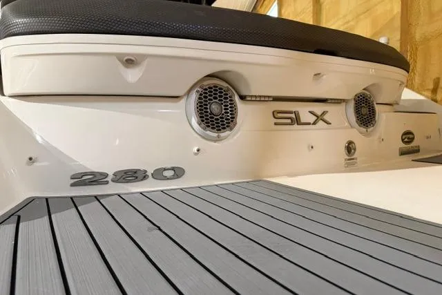 Slide: The Image of 2016 Sea Ray SLX 280 boat rear view with speakers and model branding. - 18