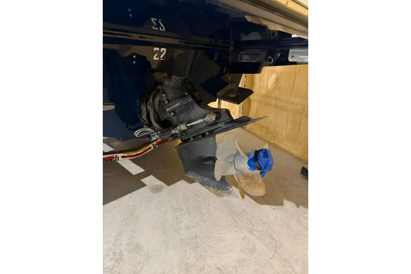Slide: The Image of 2016 Sea Ray SLX 280 boat propeller and stern drive in a garage. - 19