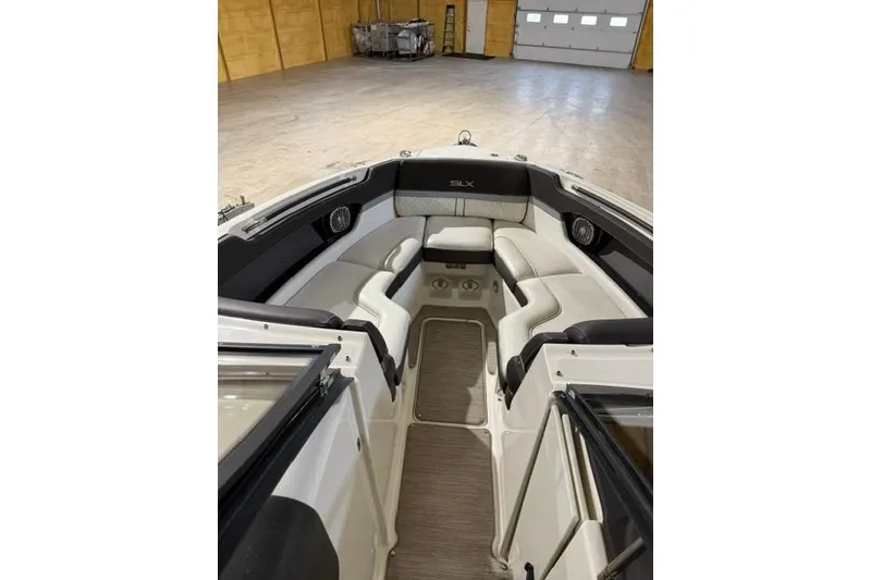 Slide: The Image of 2016 Sea Ray SLX 280 boat interior with spacious seating in a garage. - 2