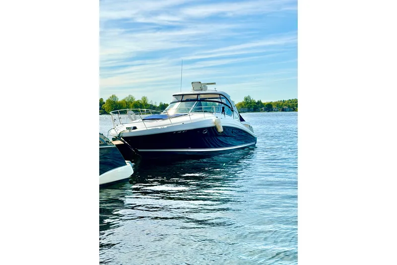 The Image of 2008 Sea Ray 44 Sundancer yacht on calm water under a clear sky. - 0