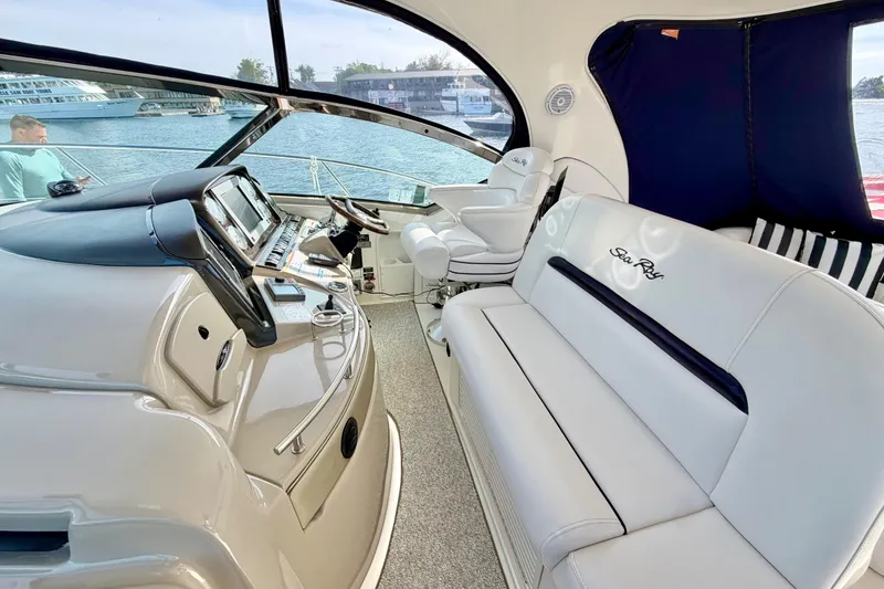 Slide: The Image of Luxurious interior of 2008 Sea Ray 44 Sundancer yacht with plush seating and modern helm. - 11