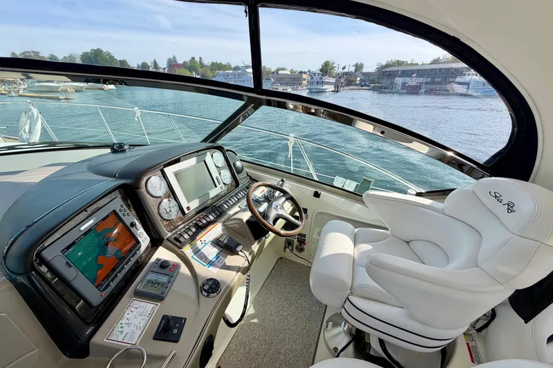 Slide: The Image of Helm of 2008 Sea Ray 44 Sundancer yacht with navigation equipment and luxurious seating. - 14